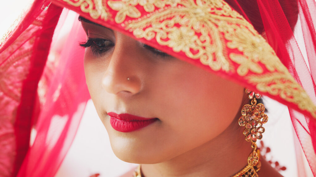 Traditional Indian Wedding Makeup: Crafted to pay homage to rich heritage and customs, showcasing vibrant colors, intricate designs, and iconic adornments like bindis and elaborate jewelry, embracing the unique styles and techniques inherent in Indian cultural beauty.